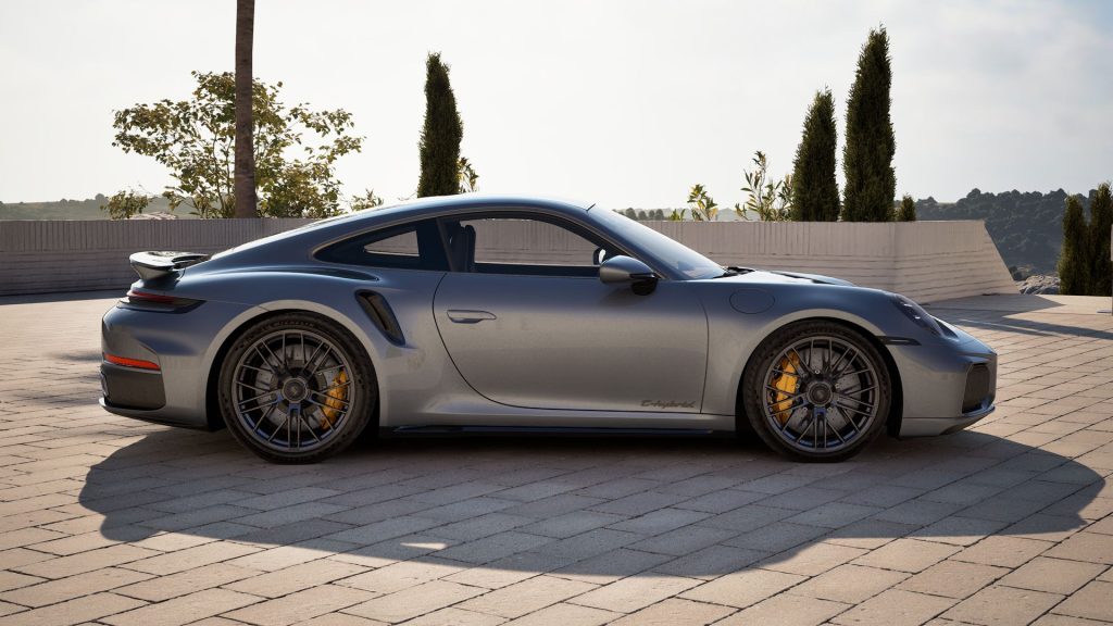 Side profile of the 2026 Porsche 911 Turbo S in metallic gray, highlighting its aerodynamic design and sporty stance.