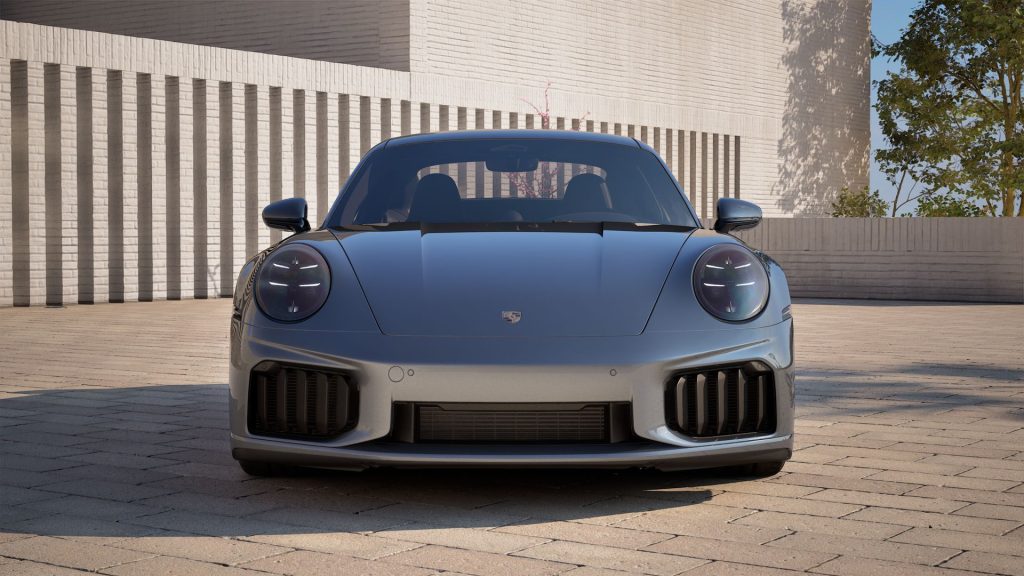 Front view of the 2026 Porsche 911 Turbo S highlighting its LED headlights, large air intakes, and bold front-end styling.