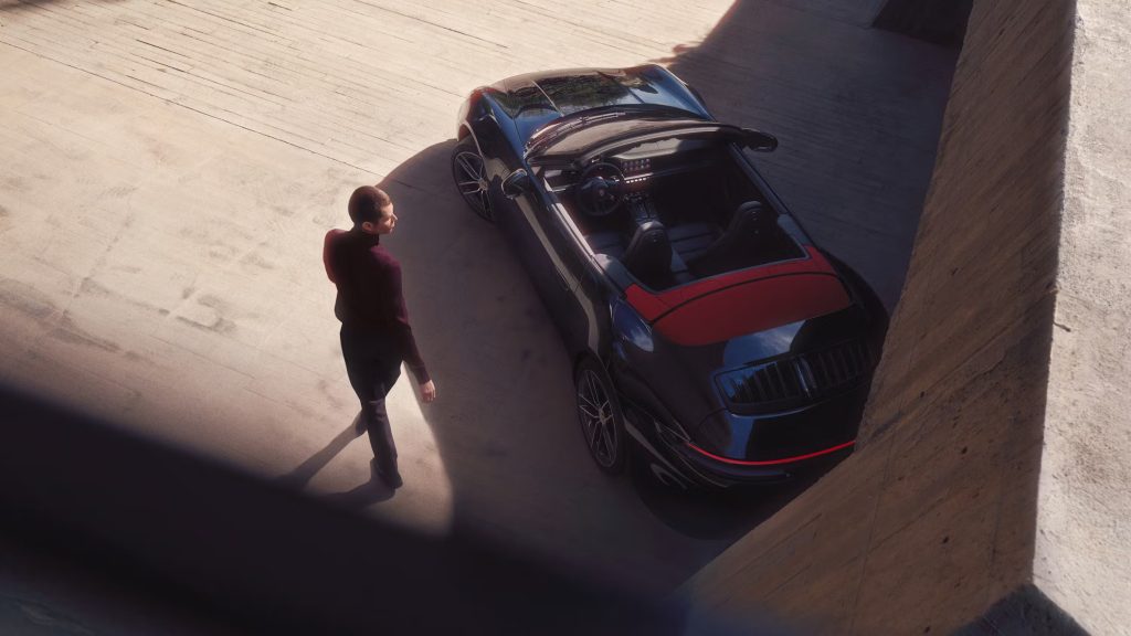 Customer selecting a Porsche Certified Pre-Owned vehicle at a dealership, representing the premium purchase experience.