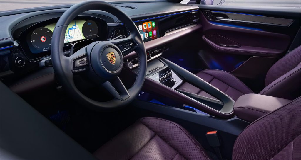 Interior driving view of the 2026 Macan Electric showing familiar layout for gas SUV drivers