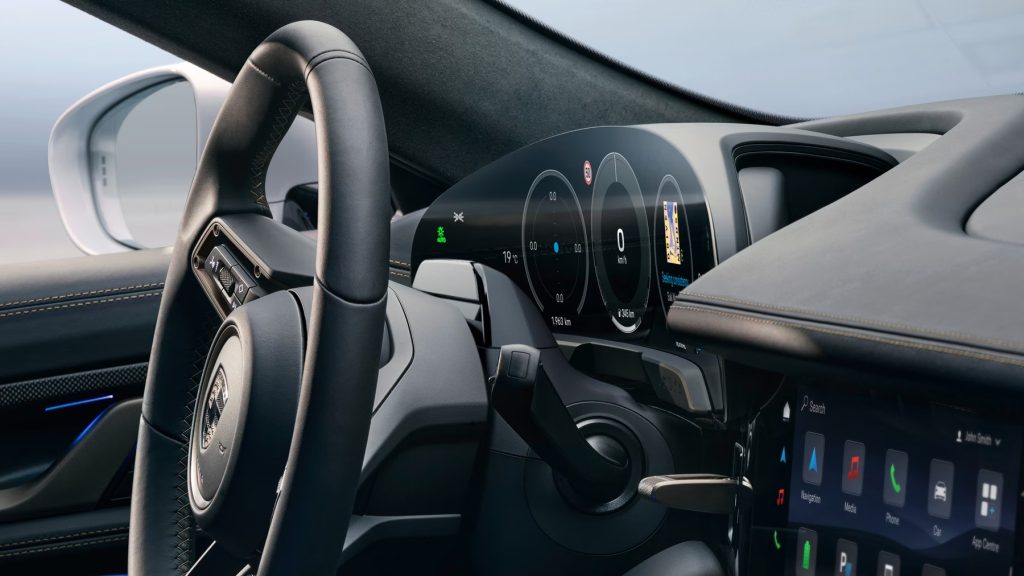 Porsche EV interior dashboard view, highlighting winter performance concerns for drivers in Chicago in the electric future.