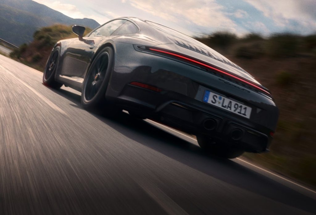 Driver-focused Porsche 911 cockpit emphasizing decision-making in financing options available for purchasing a Porsche 911 at local dealerships