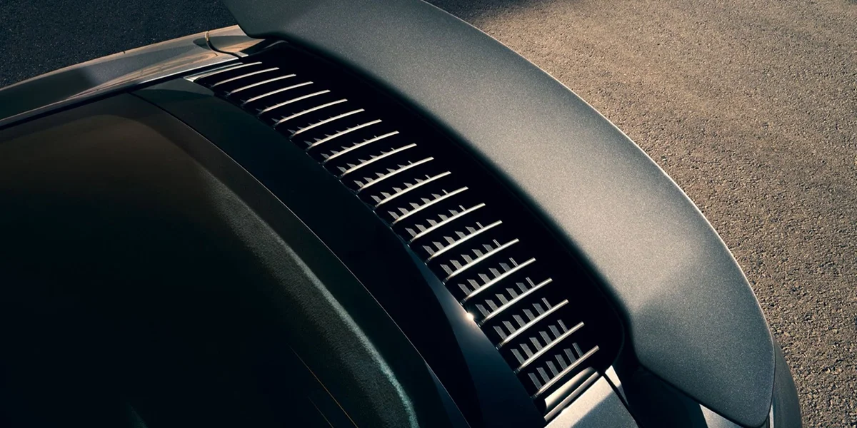 Close-up of Porsche 911 Turbo rear decklid with performance cooling vents and integrated spoiler.