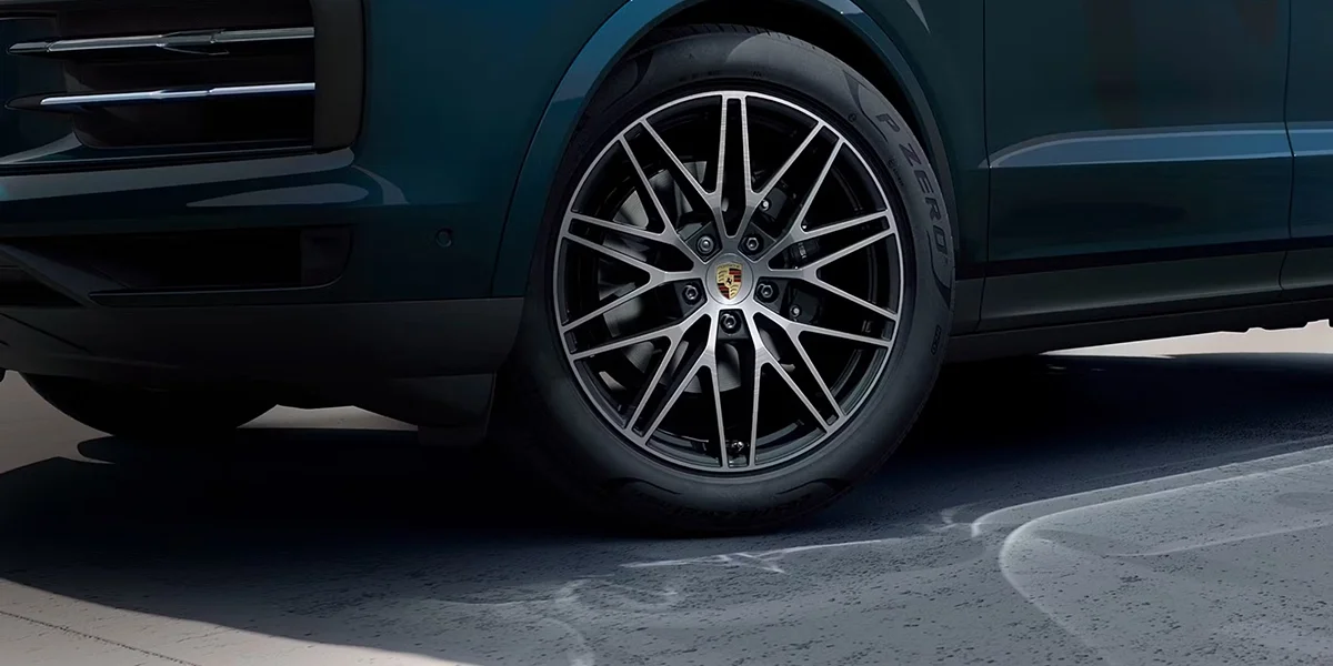  Close-up of the front wheel and suspension of the 2026 Porsche Cayenne.