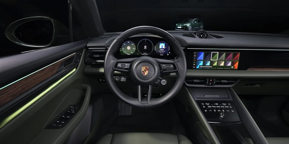 Rear view of Porsche Macan Electric 4S highlighting Porsche logo and taillight bar