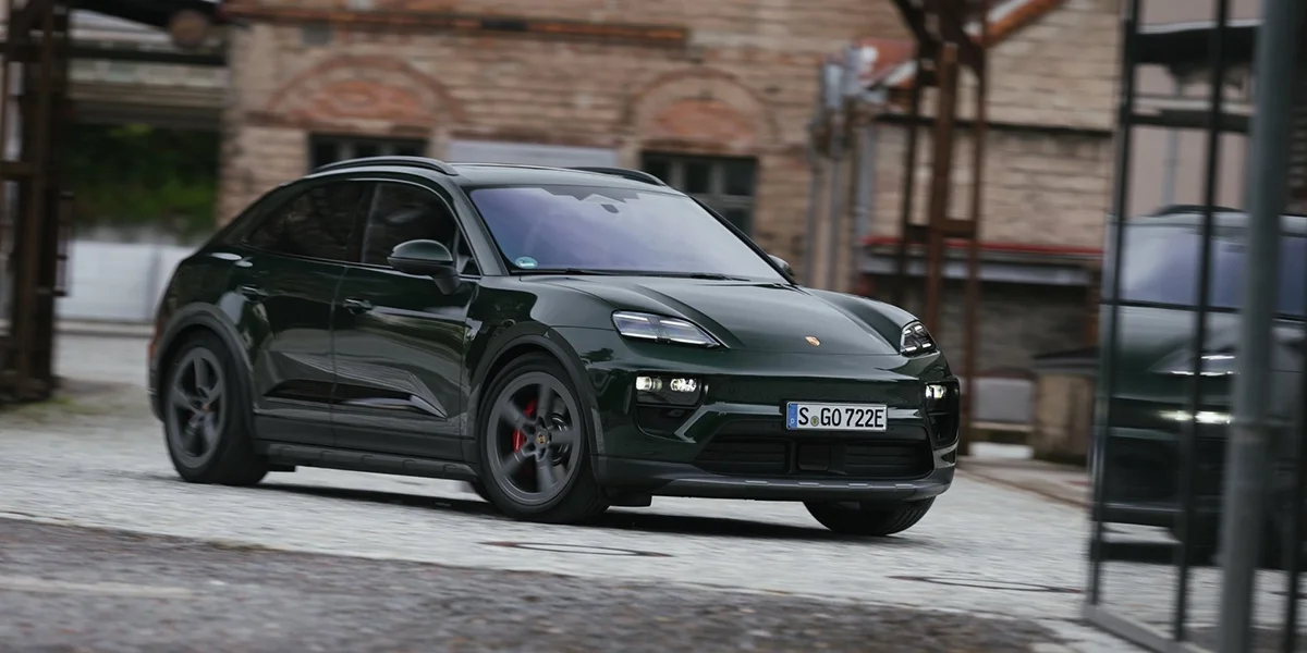 2026 Porsche Macan Electric 4s parked on city street near art gallery