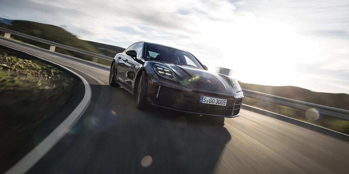 Rear angle of the 2026 Porsche Panamera displaying quad exhaust and tail lights