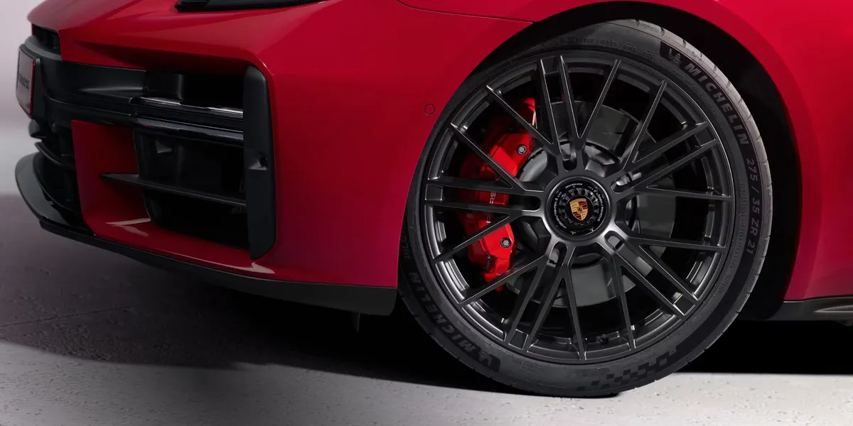 Front wheel and GTS-tuned suspension of the 2026 Porsche Panamera GTS with red calipers