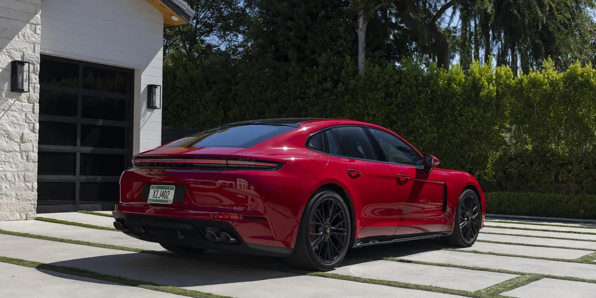 Rear angle of the 2026 Porsche Panamera GTS displaying quad exhaust and tail lights