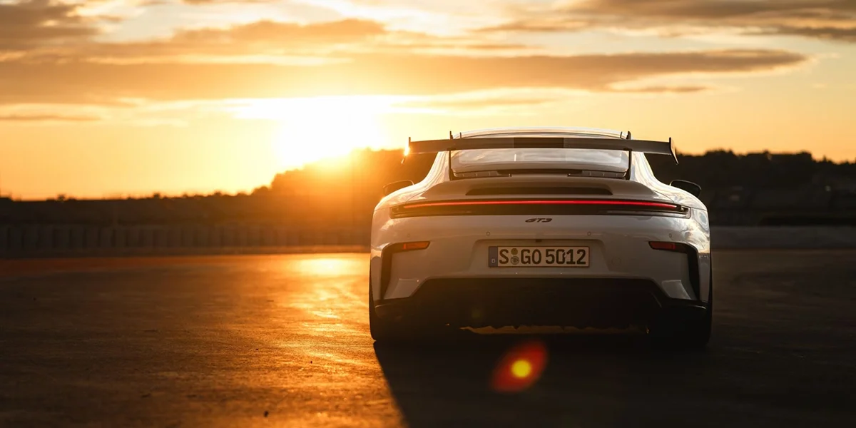 Close-up of Porsche 911 GT3 wheel with bronze finish and yellow brake caliper.