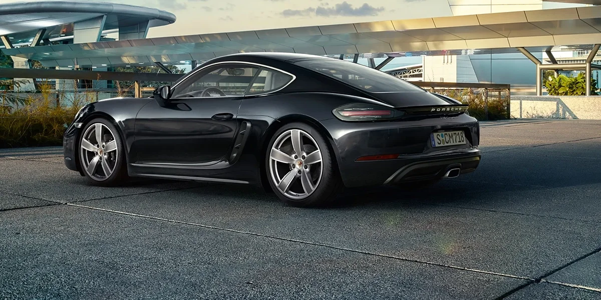 Porsche 718 Cayman parked at an angle, highlighting its low profile, sporty body lines, and premium exterior design.