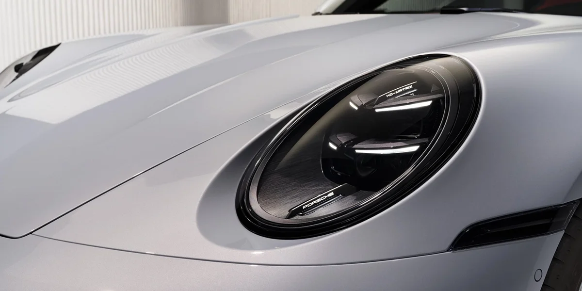 Close-up of Porsche 911 Turbo S Cabriolet front headlight design with HD-Matrix technology detail.