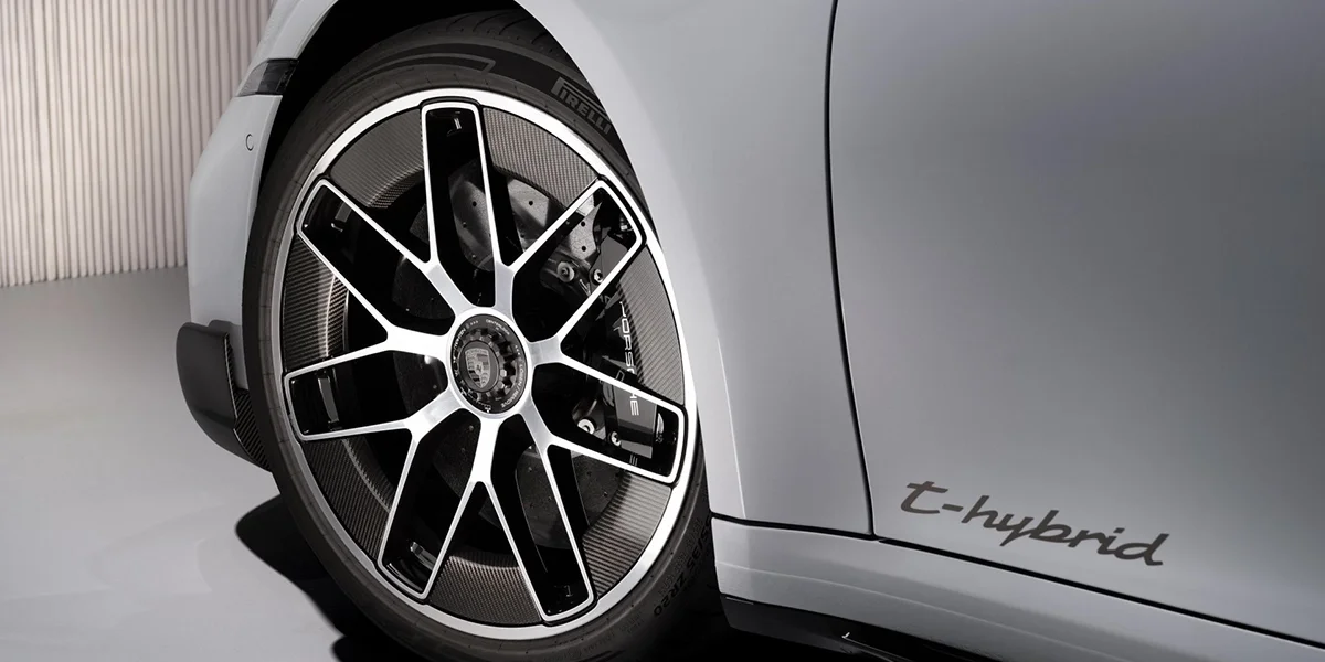 Close-up of Porsche 911 Turbo S Cabriolet rear section, showcasing spoiler, taillights, and Turbo S badge.