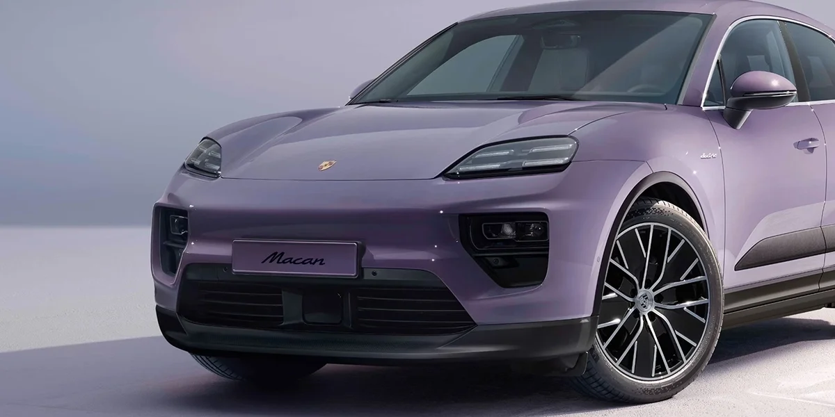 Front three-quarter view of the Porsche Macan Electric in a studio setting.