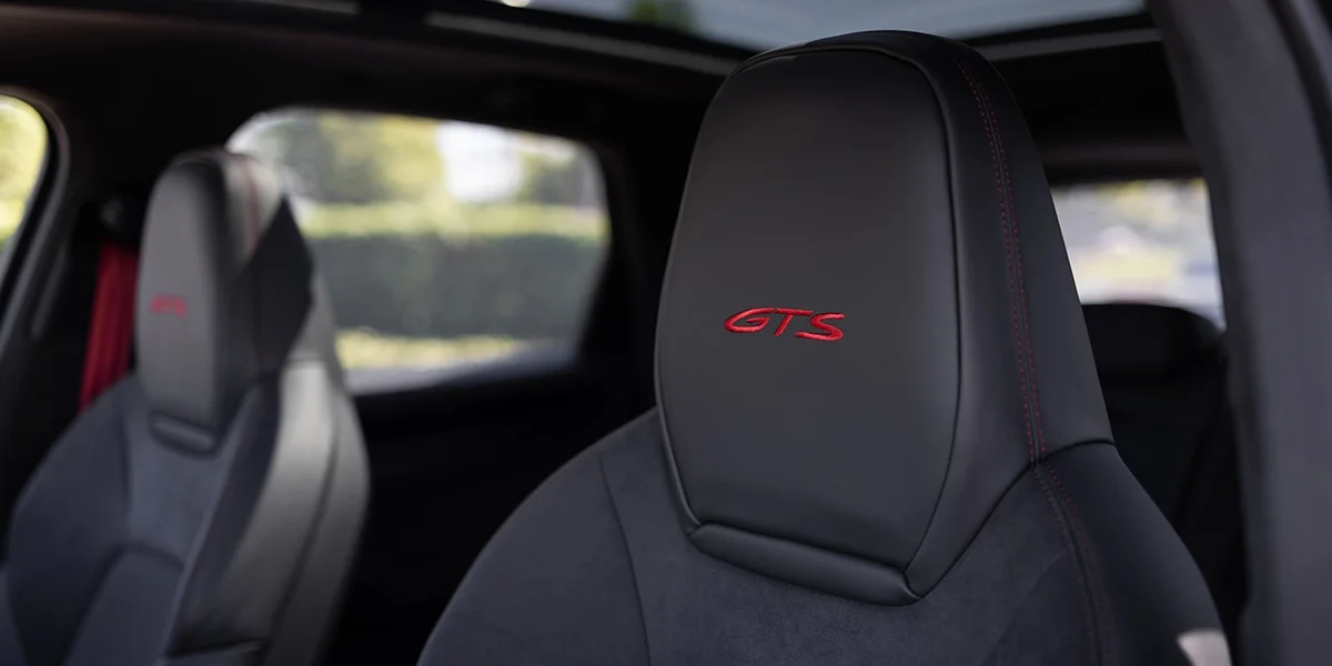 Interior view of 2026 Porsche Cayenne GTS cockpit showing digital displays and controls.