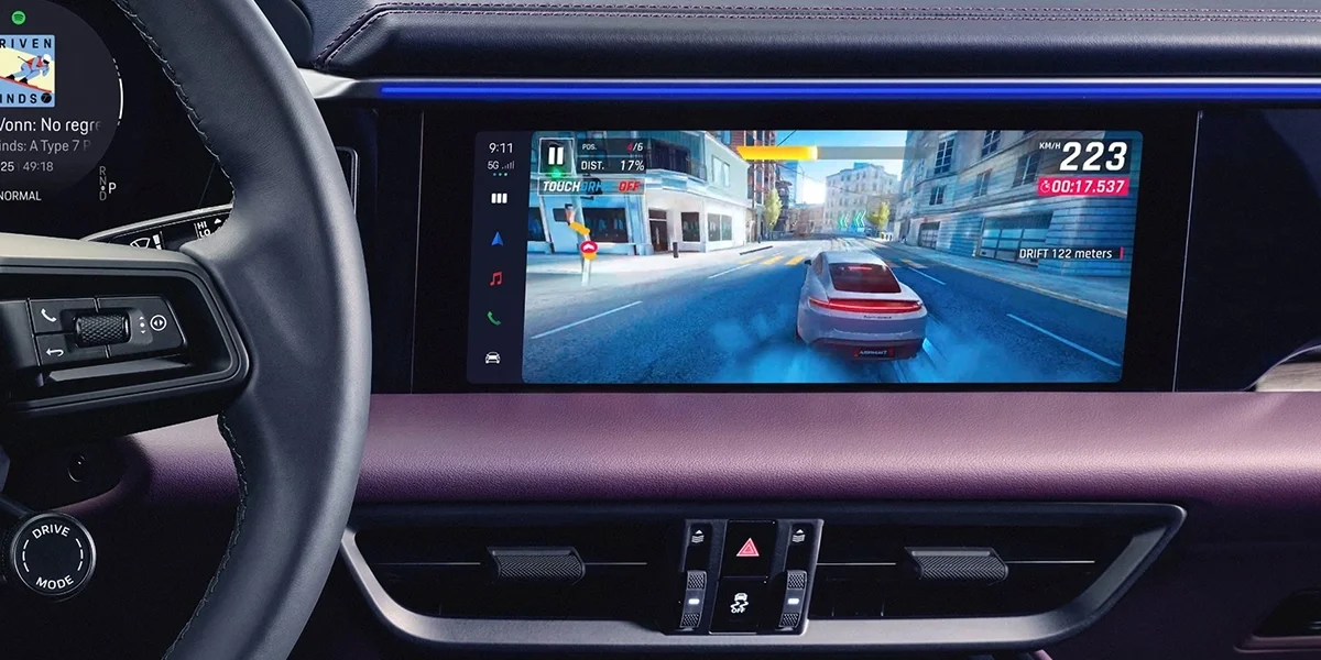 Porsche Macan Electric dashboard with widescreen infotainment display and steering wheel.