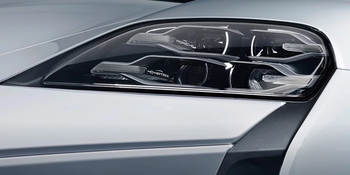 Porsche Taycan headlight close-up showing HD-Matrix LED elements.