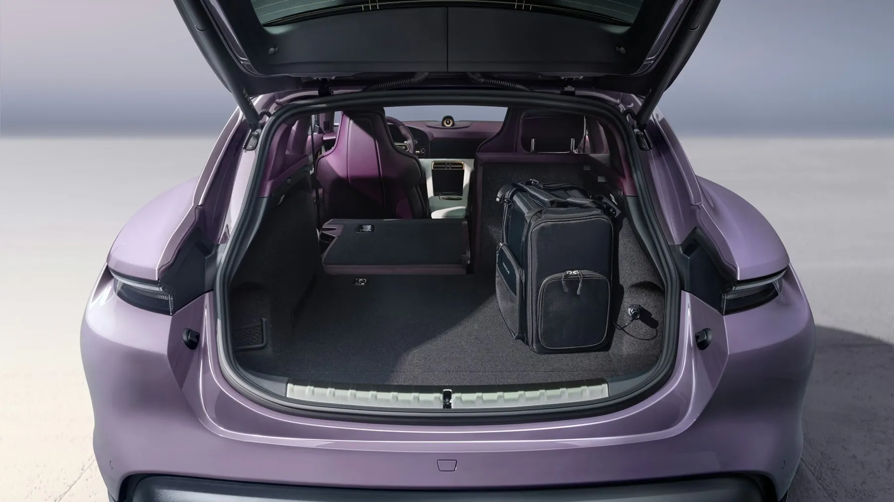 Porsche Taycan Sport Turismo rear cargo space showing practical wagon storage capacity.