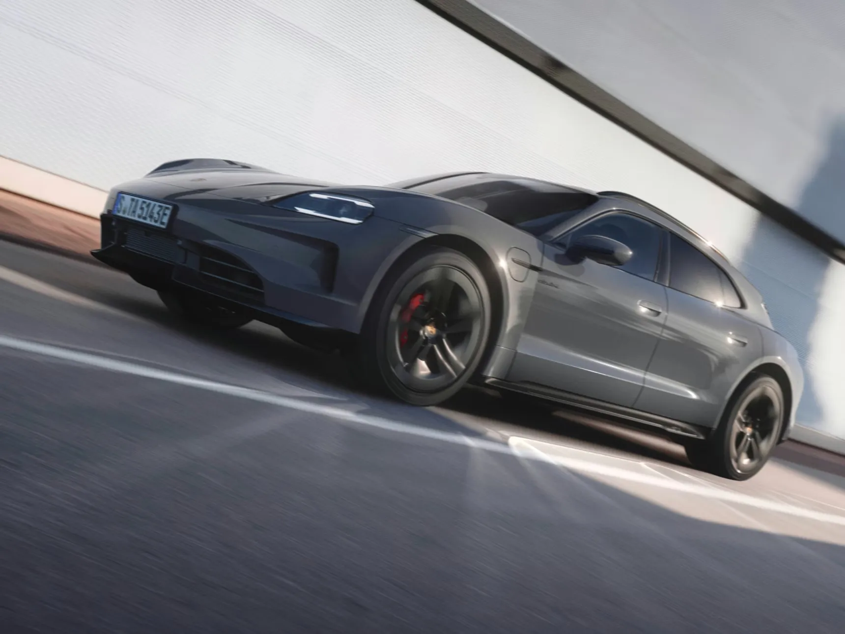 Porsche Taycan Sport Turismo electric sports wagon with sleek aerodynamic styling.